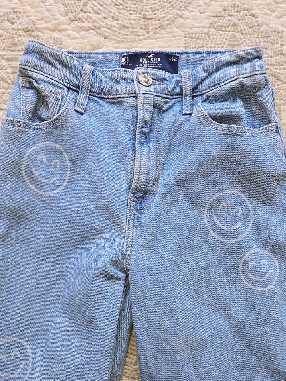 Hollister Light Blue High-Rise Jeans with White Smiley Motif